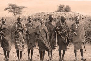 AMBOSELI, KENYA - OCT 13: Unidentified African people from Masai tribe prepare to show a traditional Jump dance on Oct 13, 2011 in Masai Mara, Kenya. They are nomadic and live in small villages.